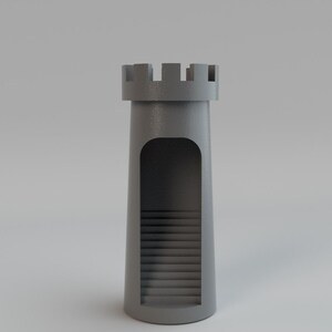 May include: A gray, cylindrical castle tower with a crenelated top. The tower has a large arched opening revealing interior stairs. The tower is a solid, 3D-rendered object, suitable for a toy or decorative item.
