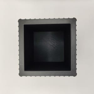 May include: A square, dark gray planter with a textured exterior and a smooth, black interior. The planter has a decorative, ridged border around the top edge. The interior dimensions appear to be approximately 6 inches square.
