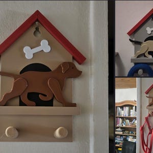 May include: Wooden dog house-shaped wall decor with a red roof, bone accent, and a brown dog silhouette. Features a shelf and two pegs for hanging items. A charming addition for pet lovers.