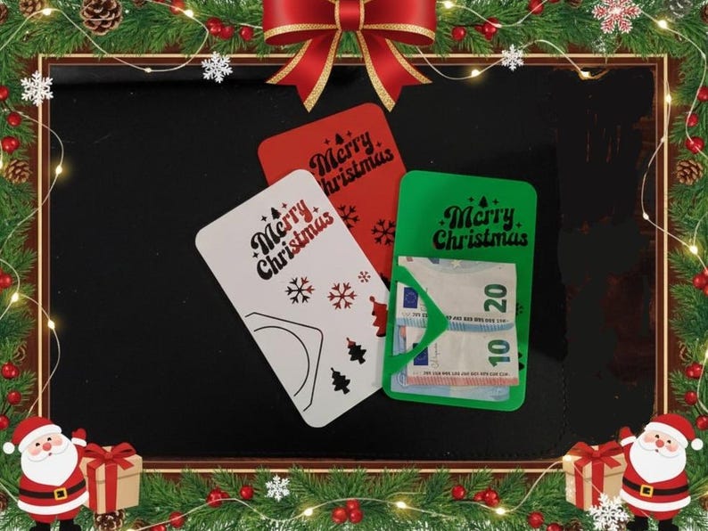 May include: Three Christmas gift card holders in red, white, and green. The white card has snowflakes and tree designs. The green card holds Euro banknotes. Each card has the text "Merry Christmas".