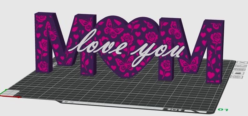 May include: A 3D decorative sign spelling "MOM" with a heart-shaped "O". The letters and heart are purple with pink butterfly and rose patterns. The words "love you" are in white script across the heart.