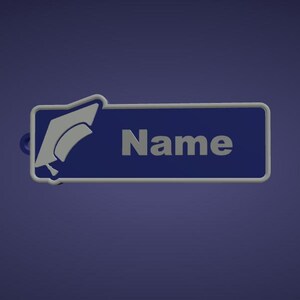 May include: A blue and white graduation-themed name tag. The name tag has a blue background with the word "Name" in white. A white graduation cap is on the left side of the name tag.