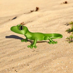 May include: A bright green gecko figurine with a detailed design, including visible toes and a curled tail. The gecko has large, black and yellow eyes. It is positioned on a sandy surface, with small plants in the background.