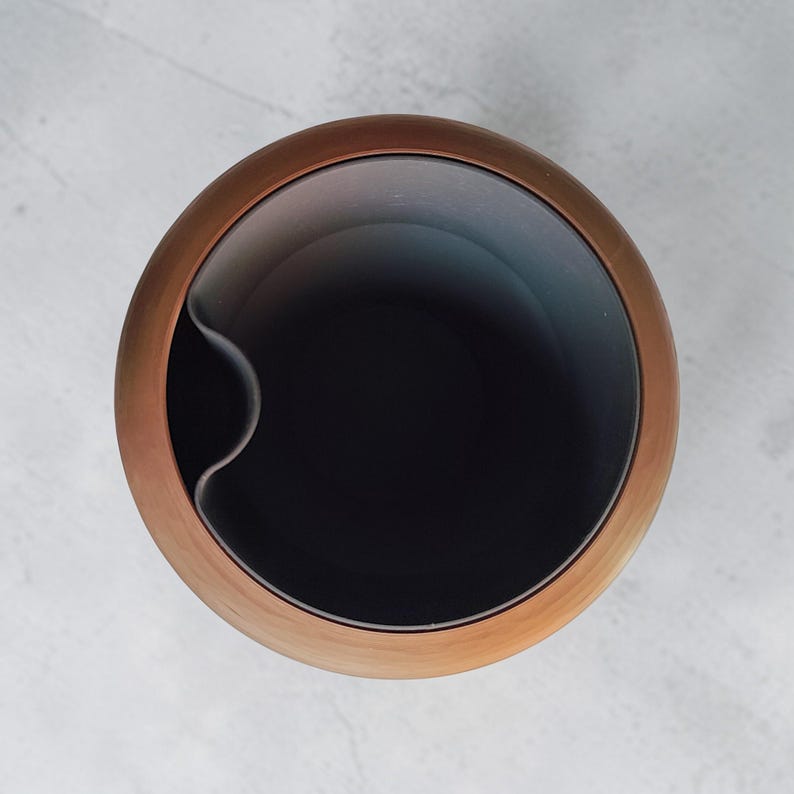 May include: A set of three ceramic mugs with a speckled, matte finish. The mugs are in shades of cream, light gray, and dark gray. Each mug has a simple, minimalist design, perfect for coffee or tea.