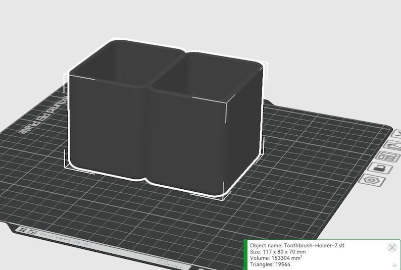 May include: A black, dual-compartment toothbrush holder. The holder is a rectangular shape with rounded corners and is approximately 4.6 inches wide, 3.1 inches deep, and 2.8 inches tall. The object is labeled "Toothbrush-Holder-2.stl".