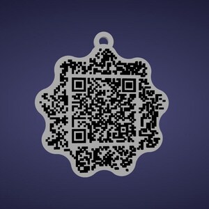 May include: A white, star-shaped pendant with a QR code design. The pendant has a small loop at the top for hanging. The QR code is black and fills the center of the pendant. The background is a solid, dark blue.