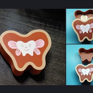 May include: A brown wooden tooth-shaped box with a smiling tooth fairy design. The box has a light brown border and a lid. The tooth fairy has pink wings. Additional images show the box open and the lid separately.