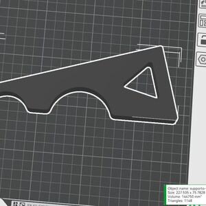 May include: A dark gray, stylized 3D model of a support structure, outlined in white, with a triangular cutout and curved sections. The object is displayed on a grid background. The dimensions are 227.535 x 75.7828 x 20 mm.