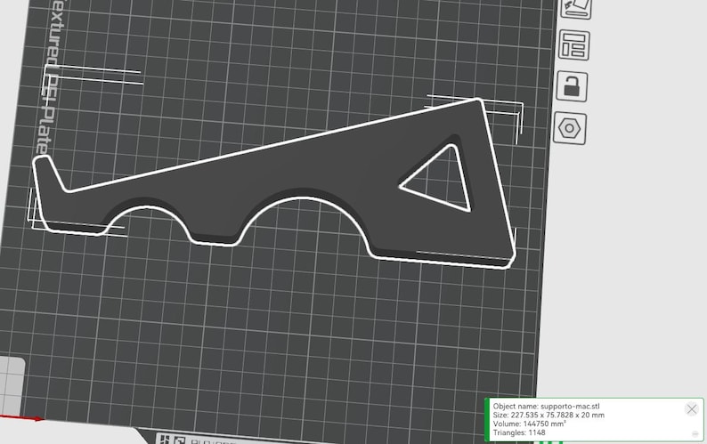 May include: A dark gray, stylized 3D model of a support structure, outlined in white, with a triangular cutout and curved sections. The object is displayed on a grid background. The dimensions are 227.535 x 75.7828 x 20 mm.