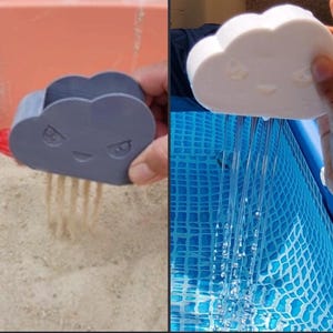 May include: A gray cloud-shaped sand mold with a smiling face and a white cloud-shaped water toy with a smiling face. The sand mold is creating sand rain, and the water toy is creating water rain. The toys are for children.