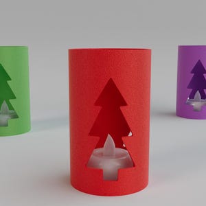 May include: Three cylindrical candle holders in green, red, and purple. Each has a Christmas tree cutout and a small, white, battery-operated candle inside. The candle holders are made of textured paper.