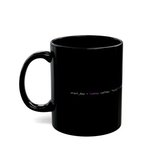 May include: A black ceramic coffee mug with a curved handle. The mug features white text that reads "start_day = lambda coffee: "Ready" if coffee". The text is in a programming code style.