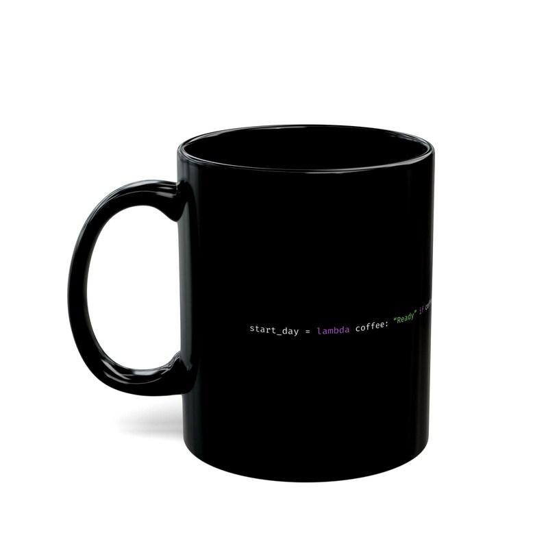 May include: A black ceramic coffee mug with a curved handle. The mug features white text that reads "start_day = lambda coffee: "Ready" if coffee". The text is in a programming code style.