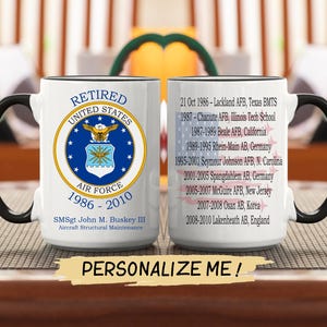 May include: A white ceramic mug with a black handle and rim. The mug features the words "RETIRED UNITED STATES AIR FORCE" and a military emblem. The mug also lists military bases and the text "PERSONALIZE ME!"