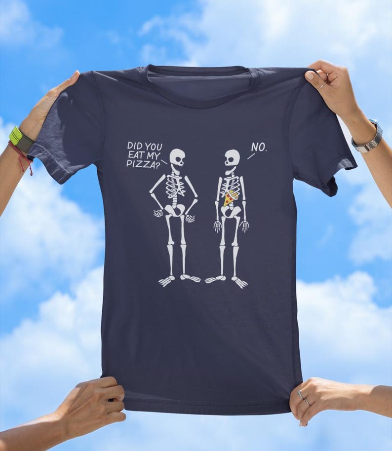 May include: A navy blue t-shirt with a graphic of two skeletons. One skeleton has a slice of pizza in its ribcage. The text on the shirt reads "Did you eat my pizza?" and "No."