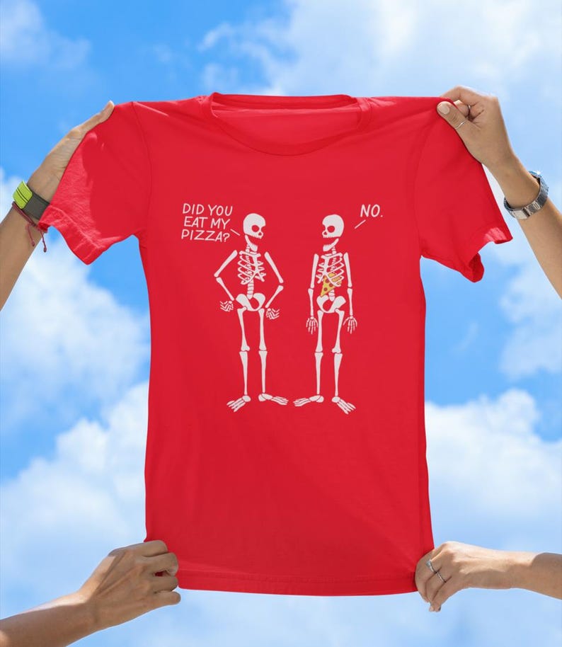 May include: Red t-shirt with a graphic of two skeletons. One skeleton has a slice of pizza in its ribcage. The text on the shirt reads "Did you eat my pizza?" and "No."