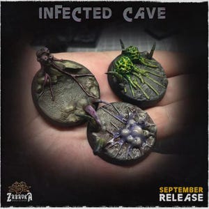 May include: Three miniature terrain bases with a dark, textured appearance. Each base features detailed, otherworldly growths in shades of green, purple, and gray. The text "INFECTED CAVE" is at the top, and "SEPTEMBER RELEASE" is at the bottom.
