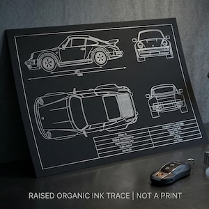 May include: A white ceramic mug with a black handle and the text "But First, Coffee" in a bold, black font. The mug is set against a blurred background, suggesting a cozy setting.