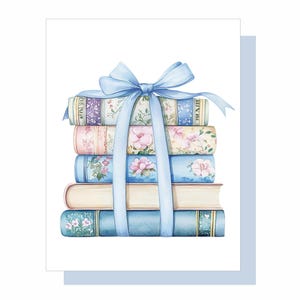 May include: A stack of five books tied with a light blue ribbon. The books have floral and patterned covers in shades of pink, blue, and purple. The ribbon is tied in a bow at the top.