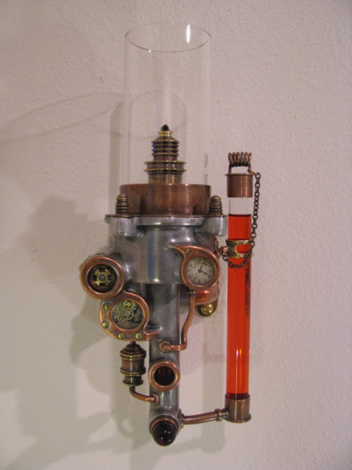 Wall mounted oil lamp made with recycled metals and glass. Etsy