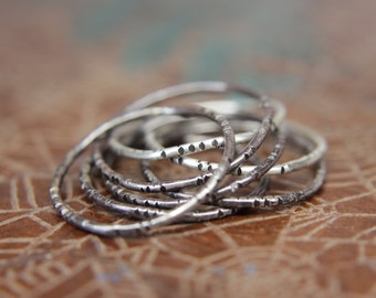 Textured wobble rings set.                                   Seven sterling silver organic stacking rings. Hand textured stacking rings set.