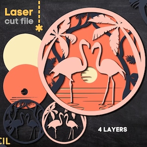 May include: Laser cut file featuring a layered design of two flamingos in a tropical sunset scene. The design includes palm trees, a sun, and the text "4 Layers". Additional cut-out circles are also shown.