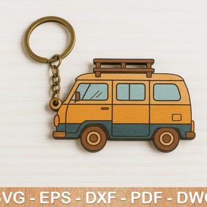 May include: A wooden keychain featuring a yellow and brown cartoon van with a roof rack. The van has a blue windshield and blue trim around the windows. The keychain is attached to a gold metal key ring.