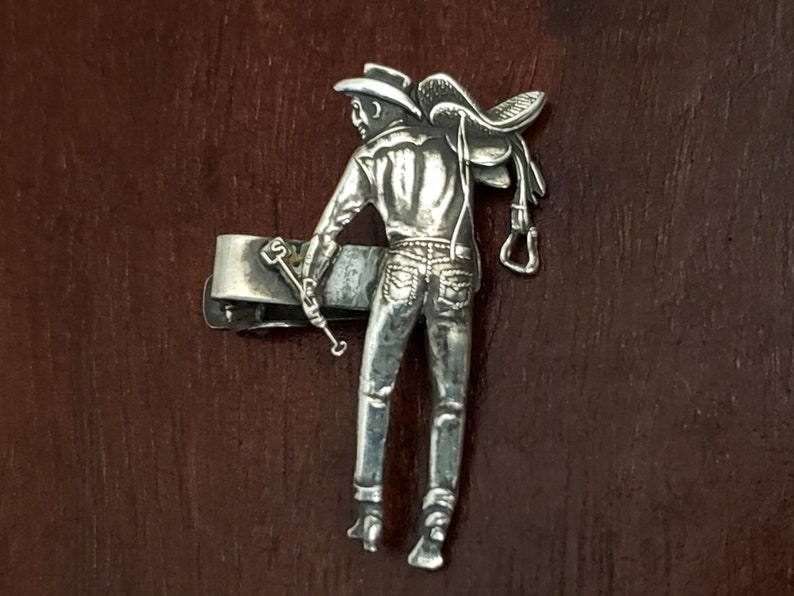 Well Detailed Adornment Vintage Sterling Silver Western Cowboy Tie Clip Full Silhouette of Man Holding a Horse Saddle and Branding Iron