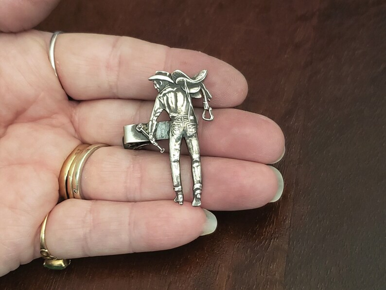 Well Detailed Adornment Vintage Sterling Silver Western Cowboy Tie Clip Full Silhouette of Man Holding a Horse Saddle and Branding Iron