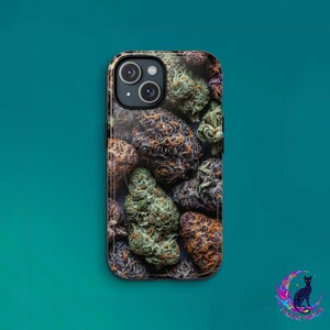 May include: A phone case featuring a close-up of various cannabis buds in shades of green, brown, and purple. The case has a glossy finish and a camera cutout. The background is a teal color.