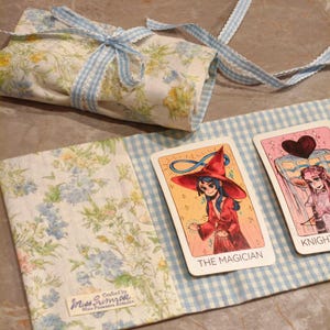 May include: A set of three ceramic mugs with a speckled, matte finish. The mugs are in shades of cream, light gray, and dark gray. Each mug has a simple, minimalist design and a rounded handle.