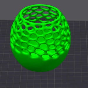 May include: A bright green, 3D printed, decorative vase with a geometric, honeycomb-like design.