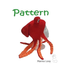 Peut inclure: Un chapeau poulpe fait main, rouge et orange. Le chapeau a une tête arrondie, deux grands yeux et huit tentacules orange. Le mot "Pattern" est écrit en vert en haut de l'image. Le chapeau est présenté sur une tête de mannequin blanche.