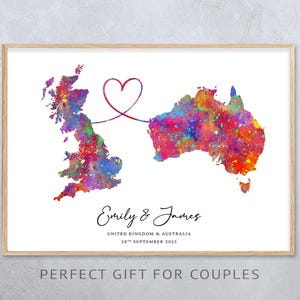 May include: A framed watercolour print showing the UK and Australia, linked by a heart-shaped line. The maps are filled with vibrant colours. The names "Emily & James" and a date are written below the maps.