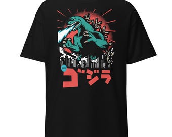 May include: Black t-shirt with a green Godzilla monster graphic, red and white city skyline, and the Japanese text "ゴジラ" in red.