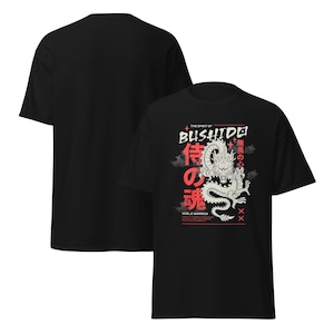 May include: Black t-shirt with a white dragon graphic and red text that reads "The Spirit of Bushido" and "Noble Warrior". The text in Japanese reads "侍の魂" and "無敵の心".