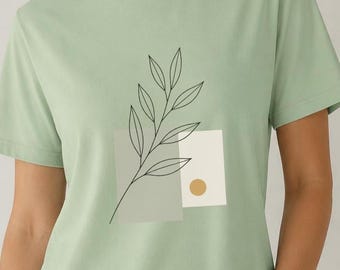Camiseta minimalista con estampado botánico lineal y formas abstractas. Top informal.