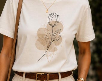 Camiseta Bella Canvas con estampado minimalista botánico lineal y formas abstractas. Top informal.