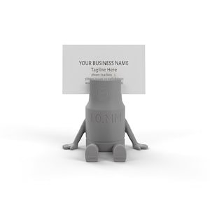 Könnte beinhalten: Ein grauer Visitenkartenhalter in Form eines Steckschlüssels mit Armen und Beinen. Der Halter zeigt "10 MM" und hält eine weiße Visitenkarte mit dem Text "YOUR BUSINESS NAME" und "Tagline Here".