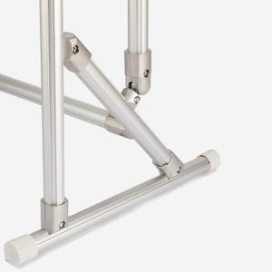 May include: A silver-colored metal frame structure composed of cylindrical tubes connected by metallic joints. The base features white plastic end caps on the horizontal bars, providing stability to the modular assembly of the support system.