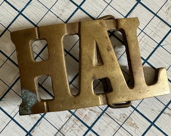 Vintage brass name belt buckle HAL