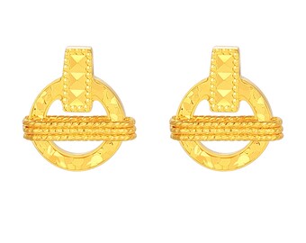 May include: A pair of gold-colored stud earrings. Each earring features a circular design with a textured surface and a rope-like detail wrapped around the center. A rectangular bar with a geometric pattern is at the top of each earring.