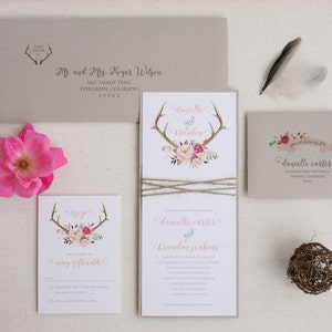 May include: Wedding invitation suite with a rustic theme. The invitation features a floral design with antlers and the text "danielle carter and brandon jenkins". The RSVP card features a similar design with the text "RSVP may fifteenth".