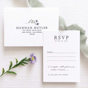 May include: RSVP card with a floral design. The card has a section for the guest's name, a checkbox to accept or decline the invitation, and a space to indicate the number of guests attending. The RSVP deadline is May 23, 2020.