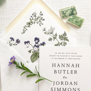 May include: A white wedding invitation with black text announcing the marriage of Hannah Butler to Jordan Simmons. The invitation is decorated with a floral pattern in shades of green and purple.
