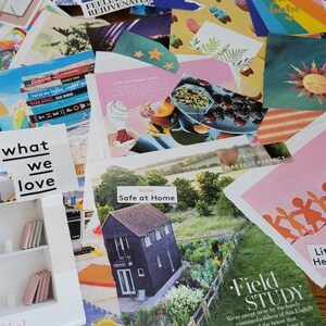 May include: A collection of colorful magazine clippings and cards, including images of food, a house, and text that reads "what we love", "Safe at Home", and "Field Study". The clippings are arranged on a wooden surface.