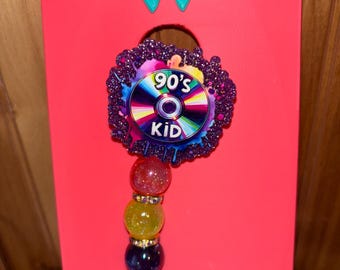 Badgehaspel met kinderbadge uit de jaren 90