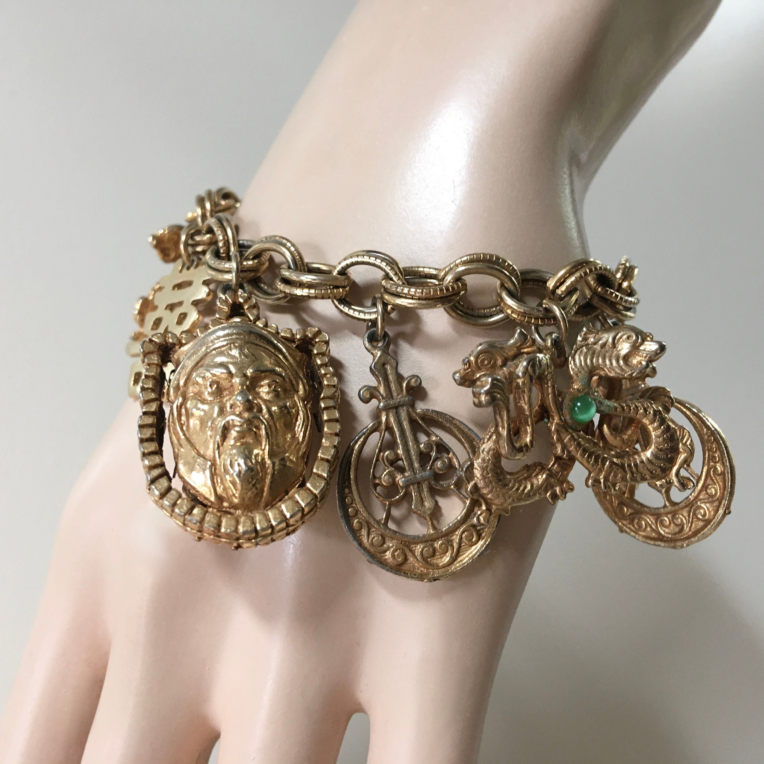 Har Asian Charm Bracelet - Signed Gold Tone - Chinese Characters Pagoda Dragons Face Charms - 1950s