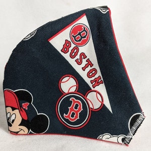 May include: A black and white face mask with a red, white, and blue Boston Red Sox logo and Mickey Mouse print.