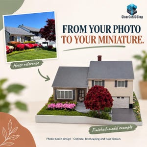 Photo-based comparison of a cream house reference photograph and its corresponding miniature, with grey roofs, a red tree and pink flowers. From Your Photo to Your Miniature. Landscaping and display base are optional.